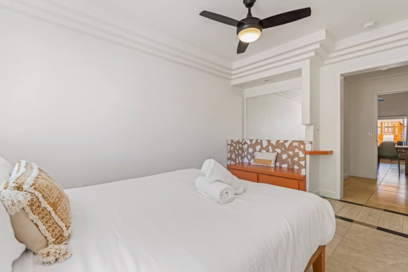 Another airy bedroom w/ warm accents & soft textures that make settling in feel effortless.
