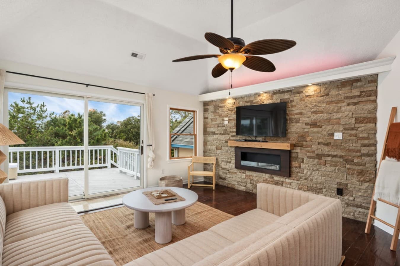 Cozy living area w/ stone fireplace & TV for relaxed nights in.