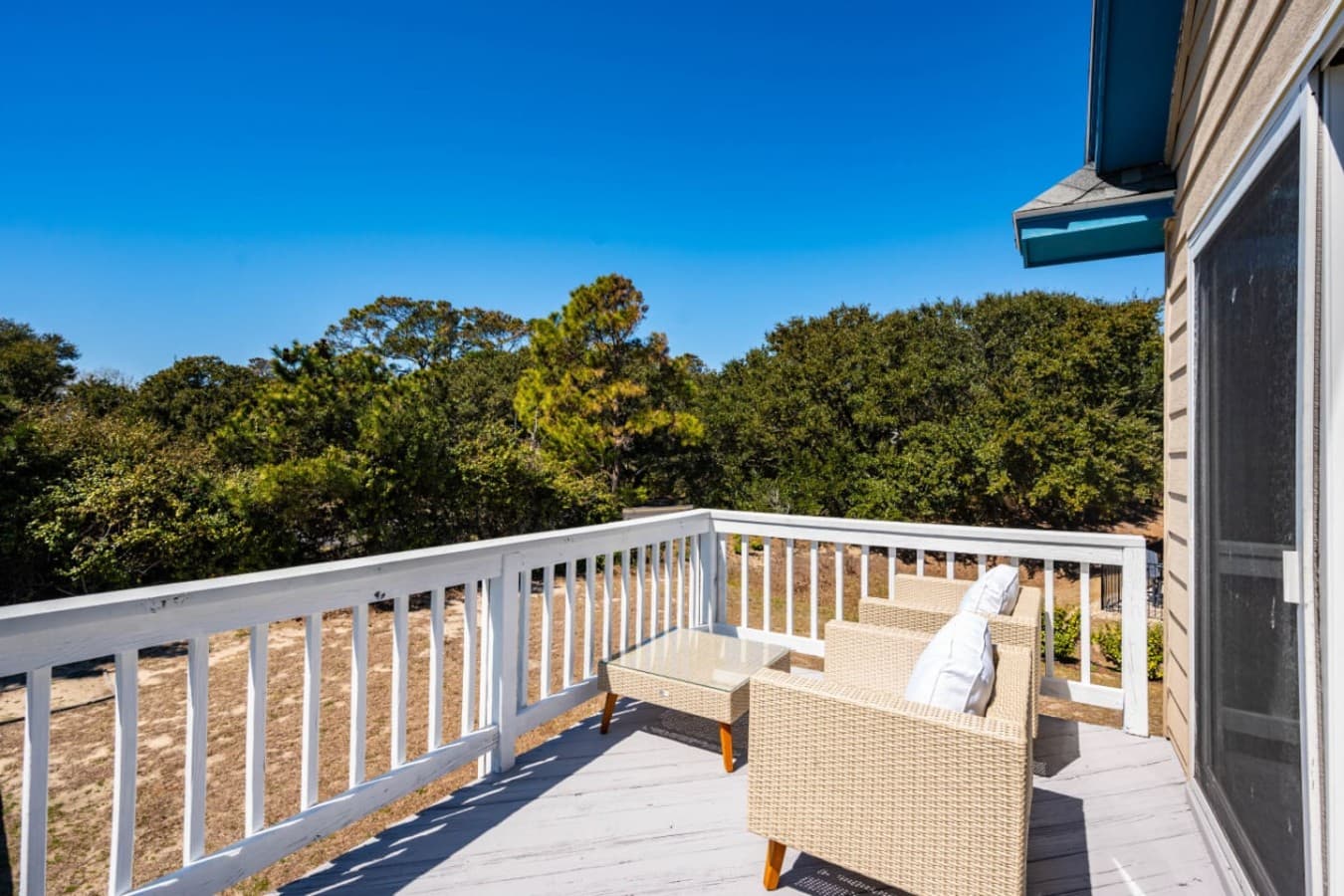Upper deck railing frames peaceful views over the surrounding neighborhood.
