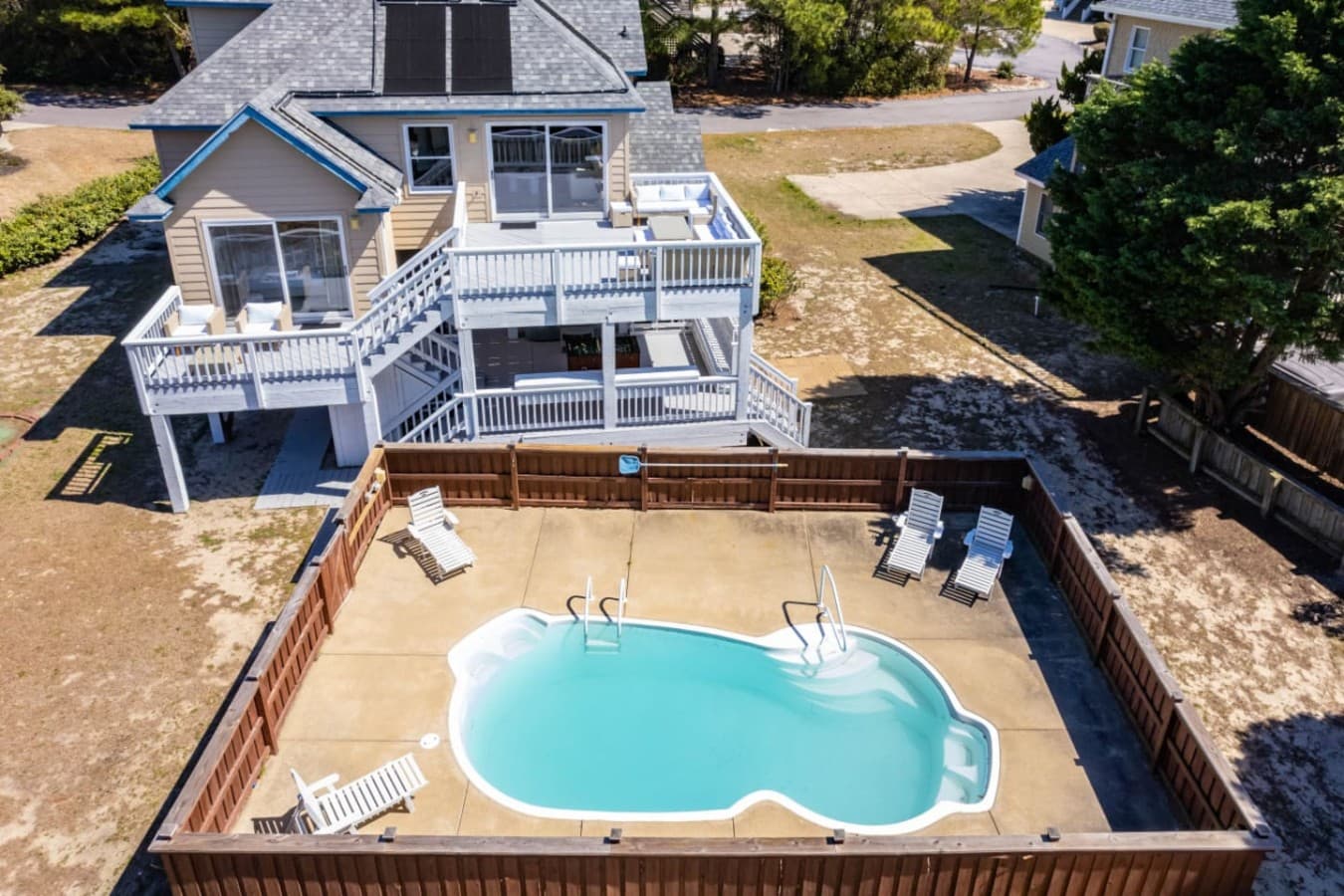 Aerial view showcasing the private pool & home layout from above.
