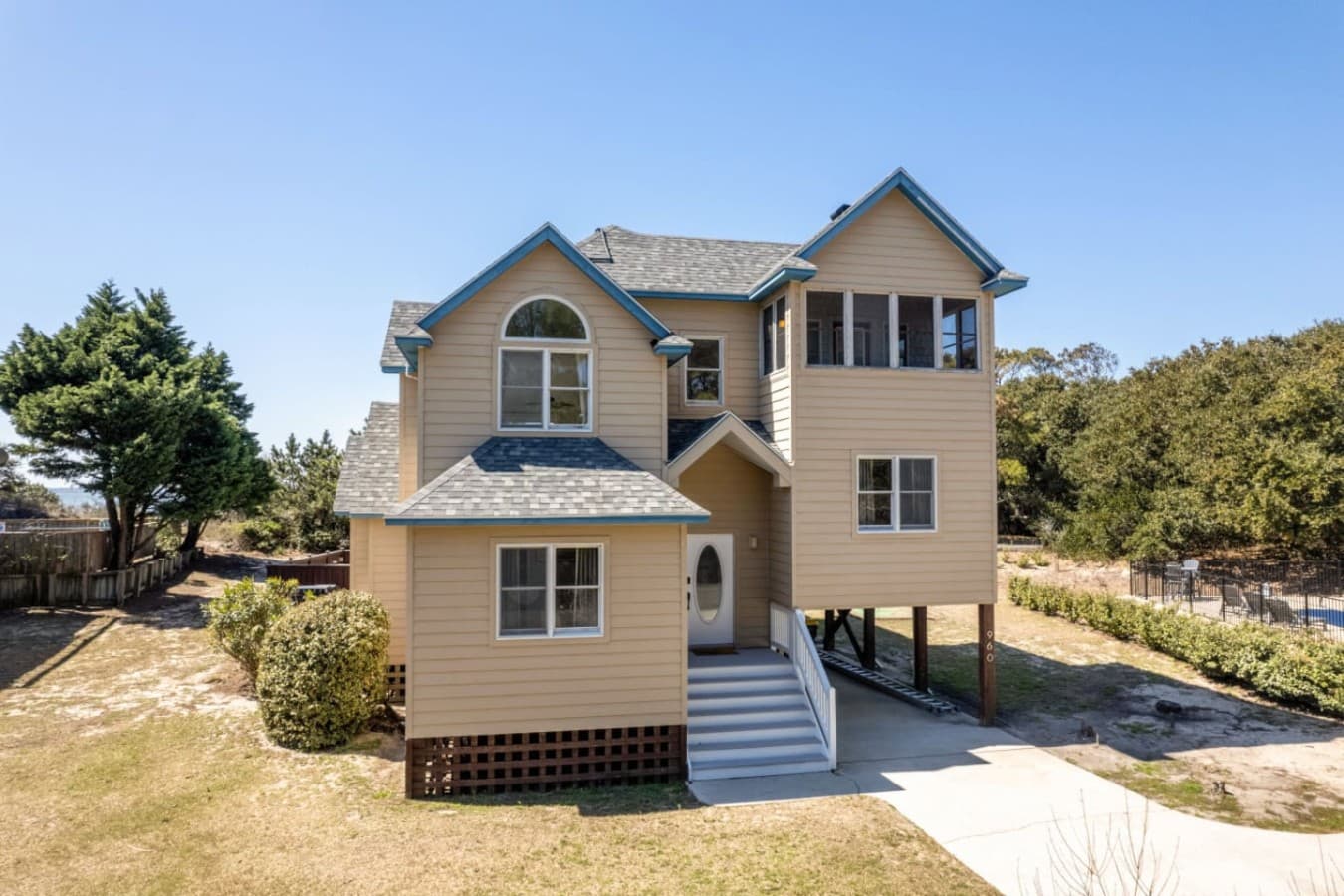 Front exterior view highlighting the home’s classic coastal style.