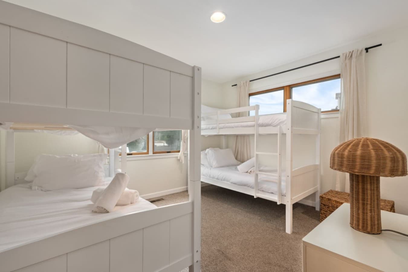 Bright bunk room w/ crisp linens & a clean, comfortable setup for easy stays.