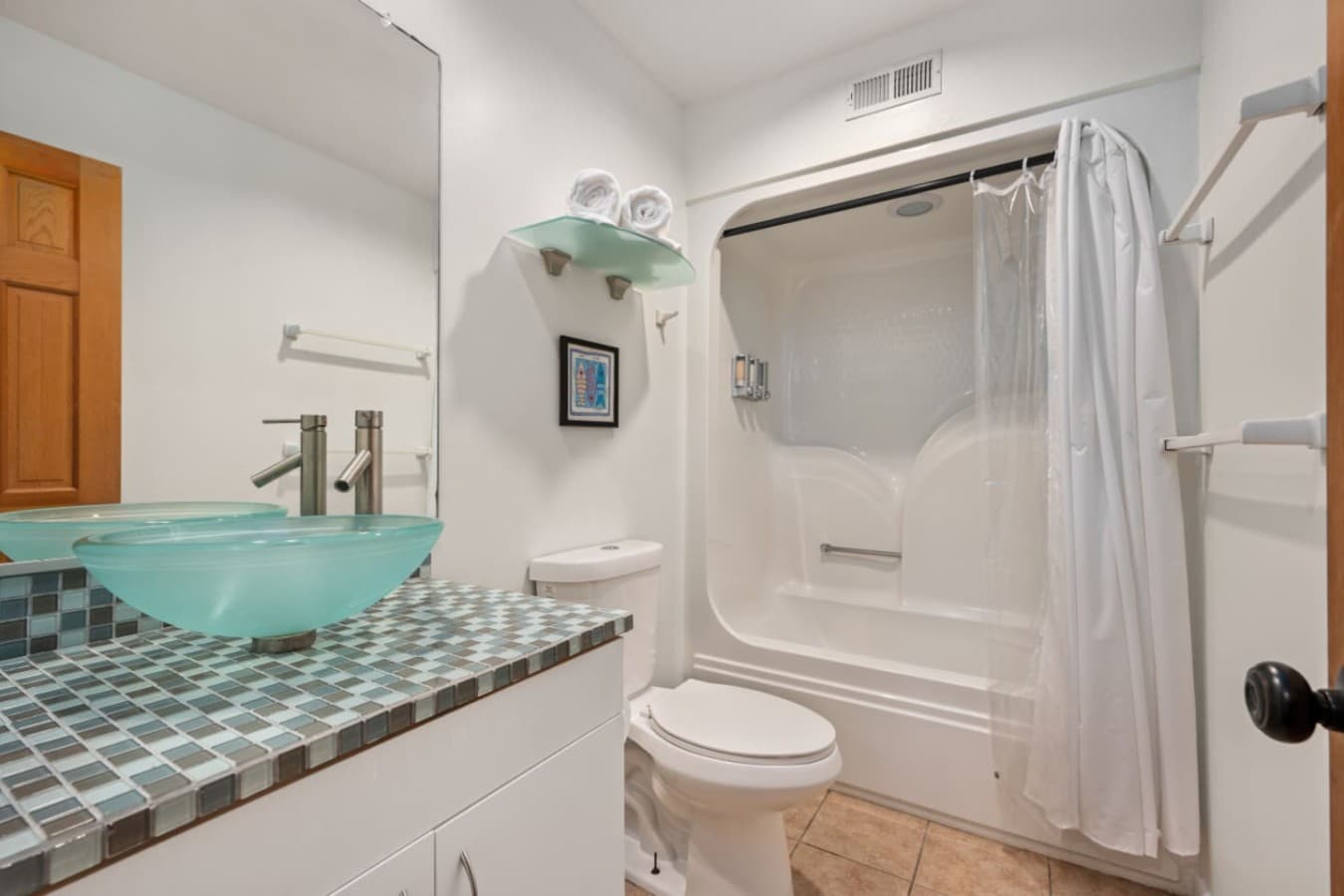 Tub & shower combo w/ simple white surround for easy, everyday comfort.