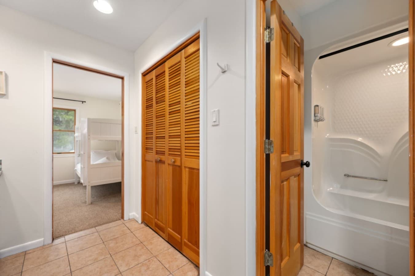 Hallway view showing easy flow between bedrooms & bath.