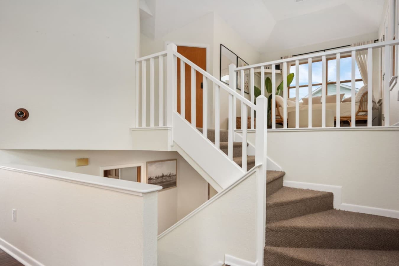 Open stairway & loft-style landing create an airy, connected feel between levels.