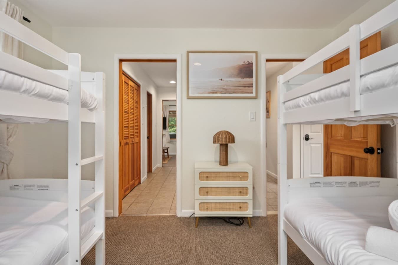 Bunk room w/ built-in beds & storage, designed for comfortable group stays.