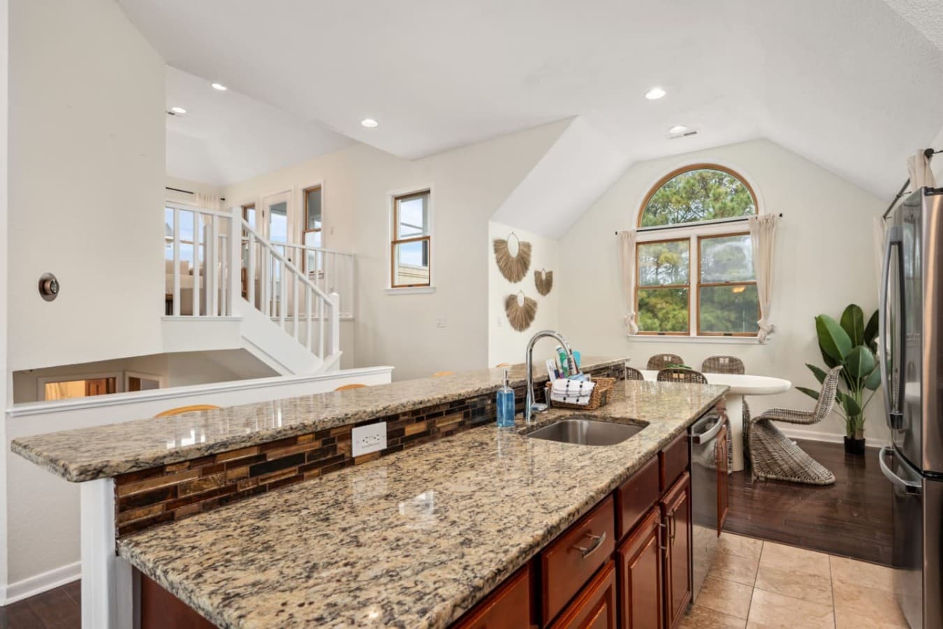 Inviting living area w/ coastal decor & easy flow to the outdoors.