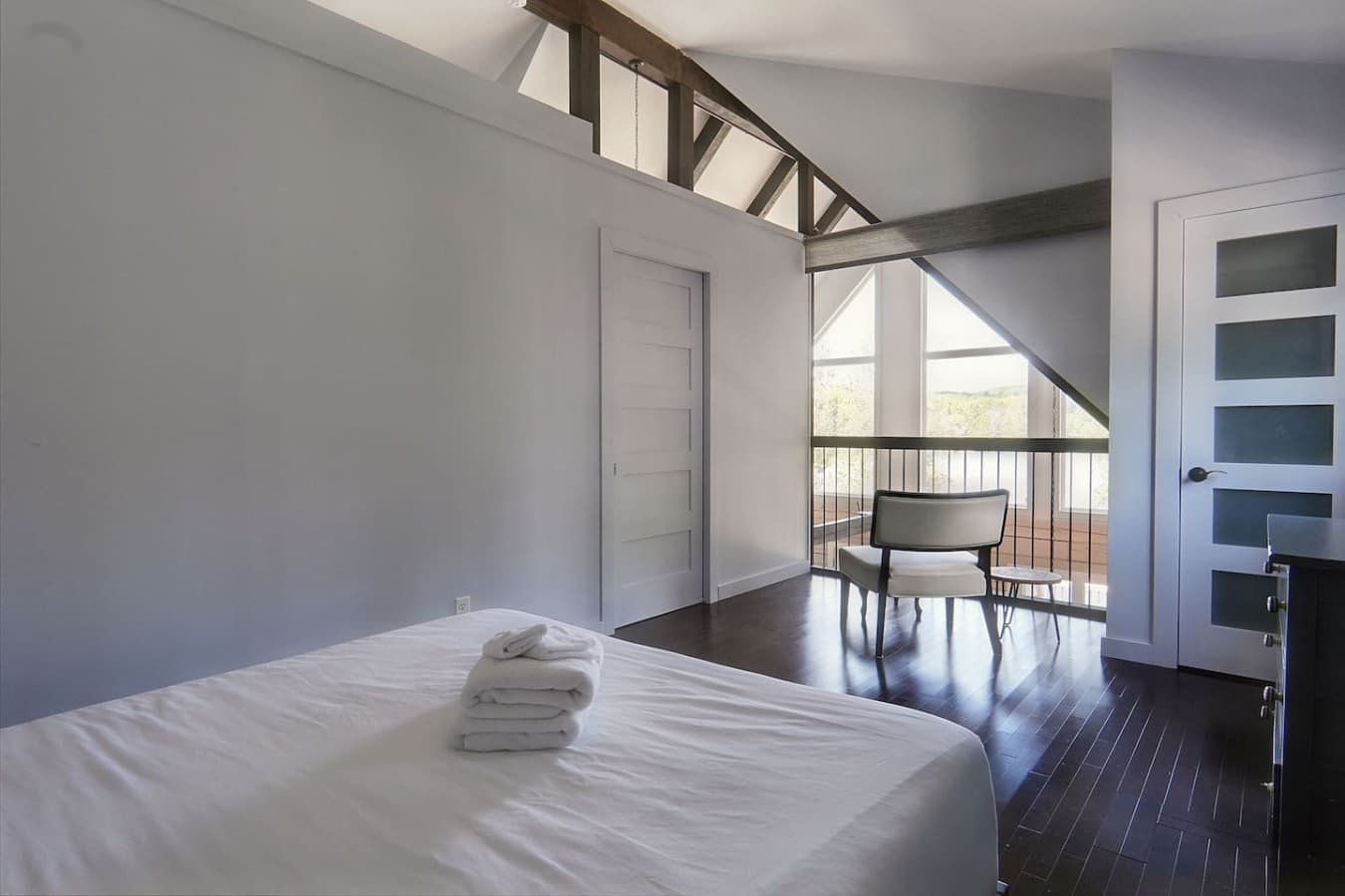 Top floor master bedroom in main cottage with privacy blind