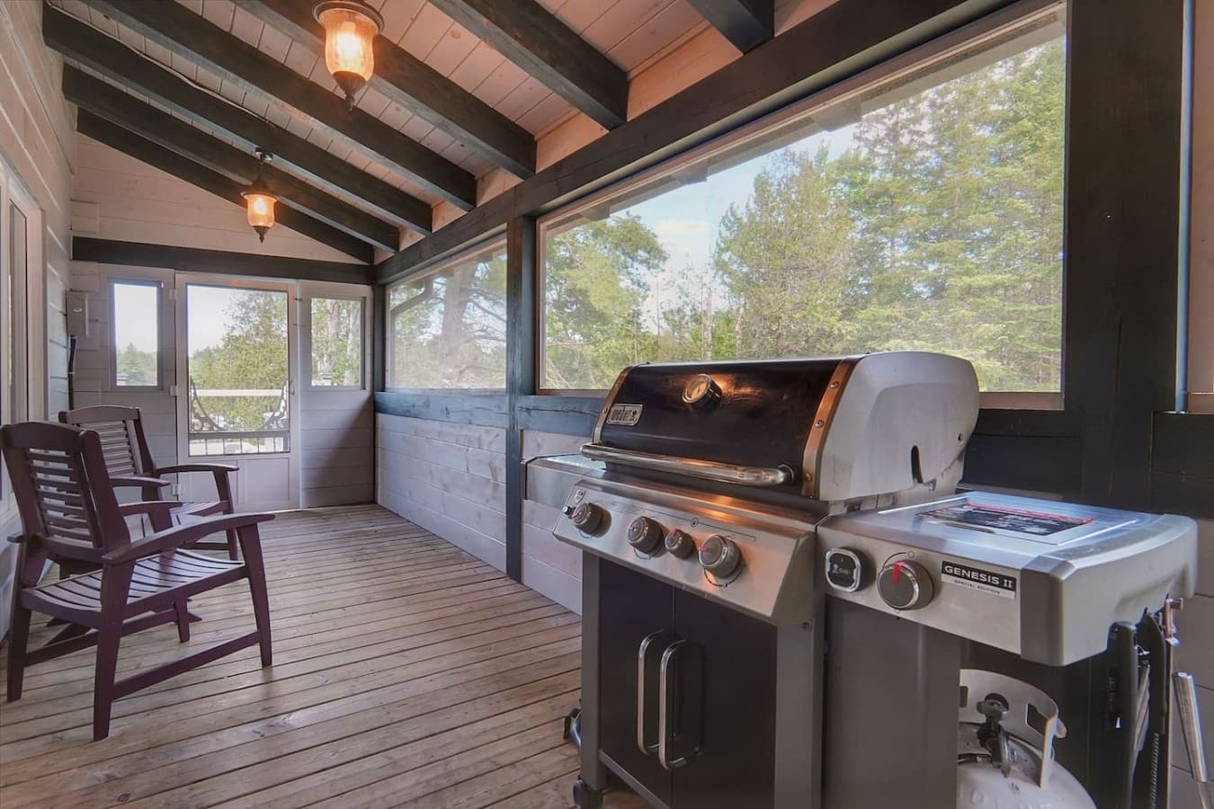 Weber bbq in covered porch of main cottage.