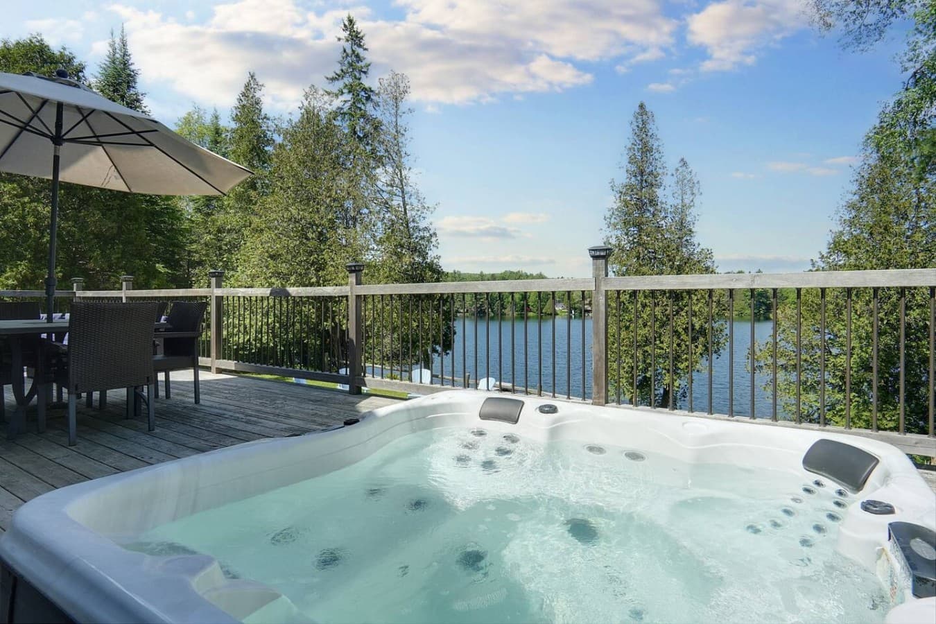 hot tub overlooking the lake on large deck