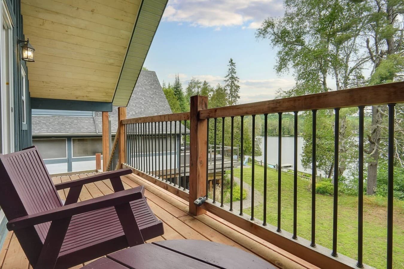 Bunkie balcony overlooking lake and main cottage