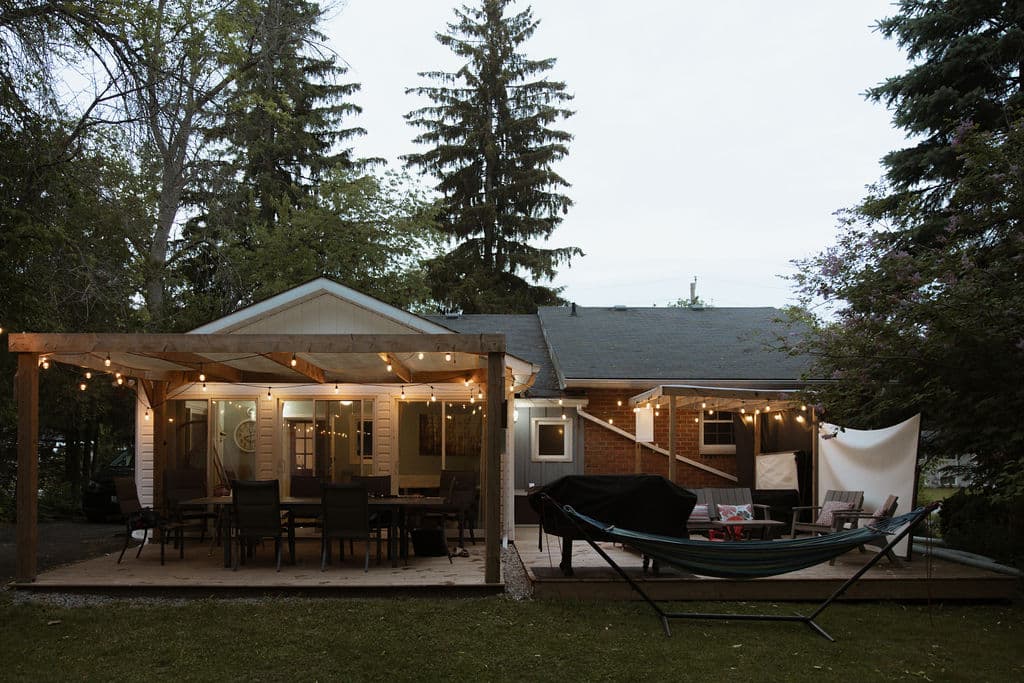 Your home for outdoor moments: roomy deck space and firewood ready for use.