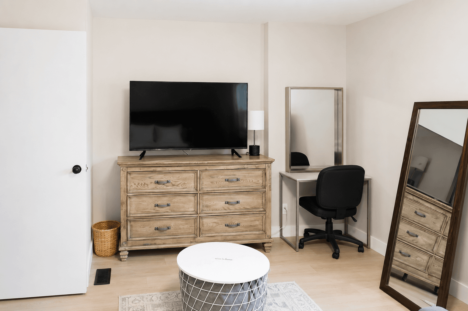 Your comfortable escape: primary bedroom with TV, pull-down couch, desk, soft carpet, dresser, closet, USB lamps, and cozy robes.