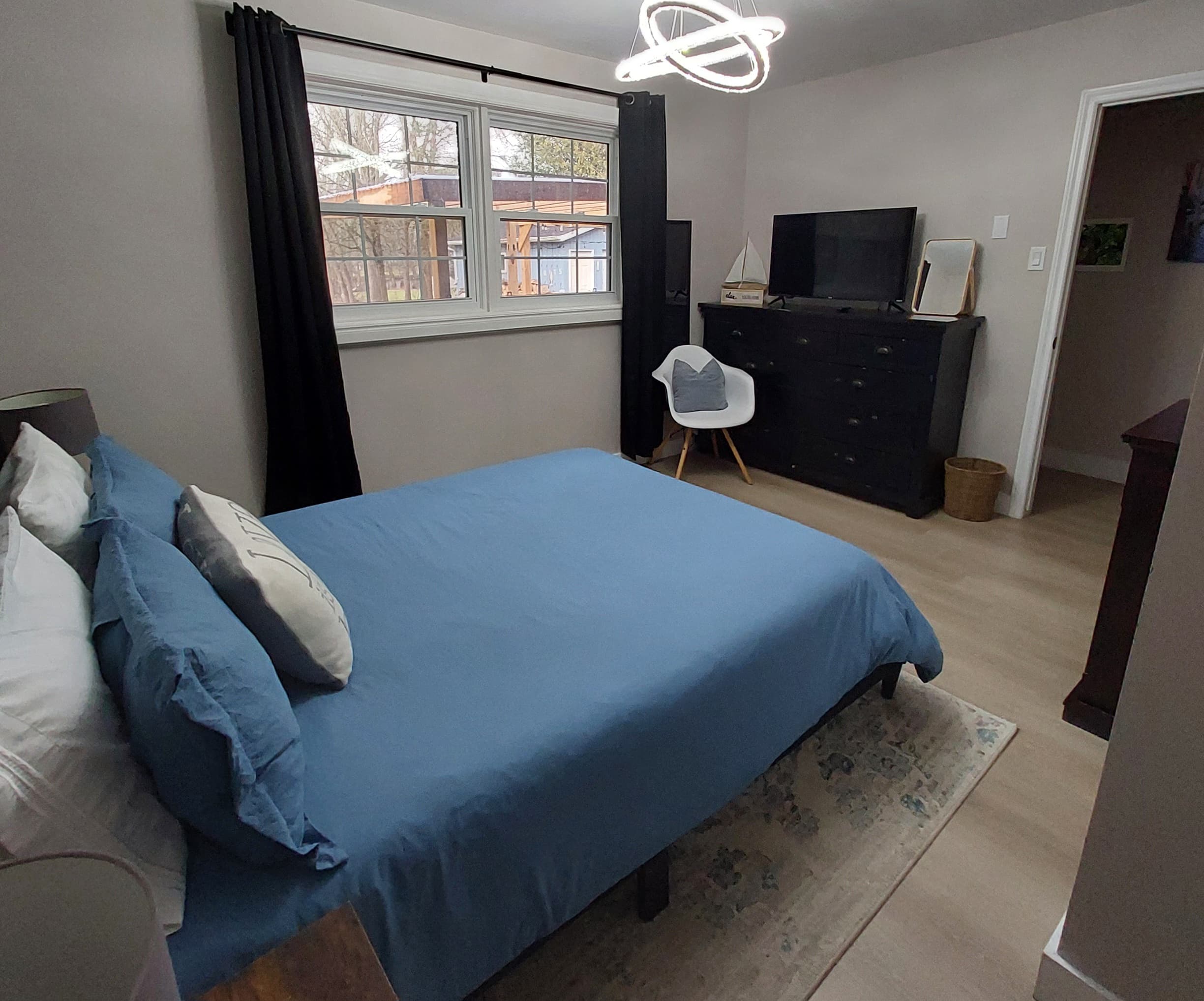 Bedroom 2: your quiet retreat with TV, dresser, closet, chair, USB lamps, electric fireplace and 2 plush robes for cozy nights in or a trip to the hot tub.