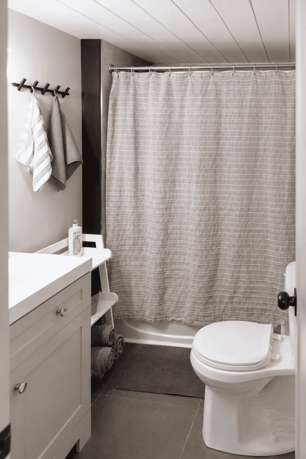 Family-friendly bathroom with rain head shower, shampoo, bath toys, baby potty, and extra add ones to delight both the young and young-at-heart.