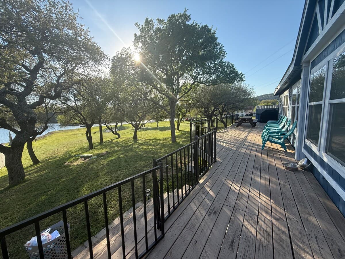 Large deck facing the lake. Over 1 acre of lakefront property. 