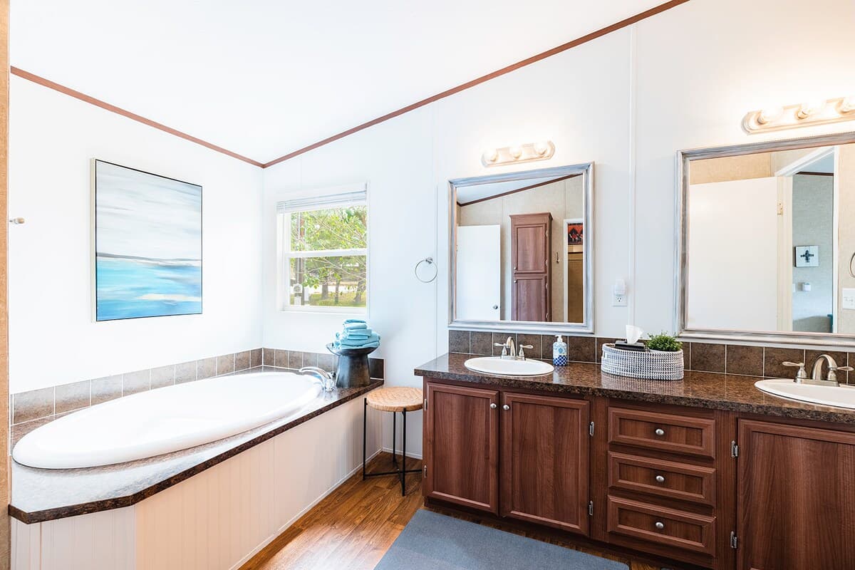 Relax in the master bath featuring a walk-in shower and jetted soaking tub—perfect for unwinding after lake or trail adventures.