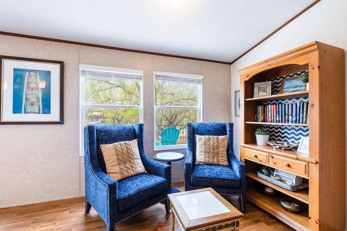 Cozy sitting nook with bright natural light—perfect for morning coffee or reading by the lake.