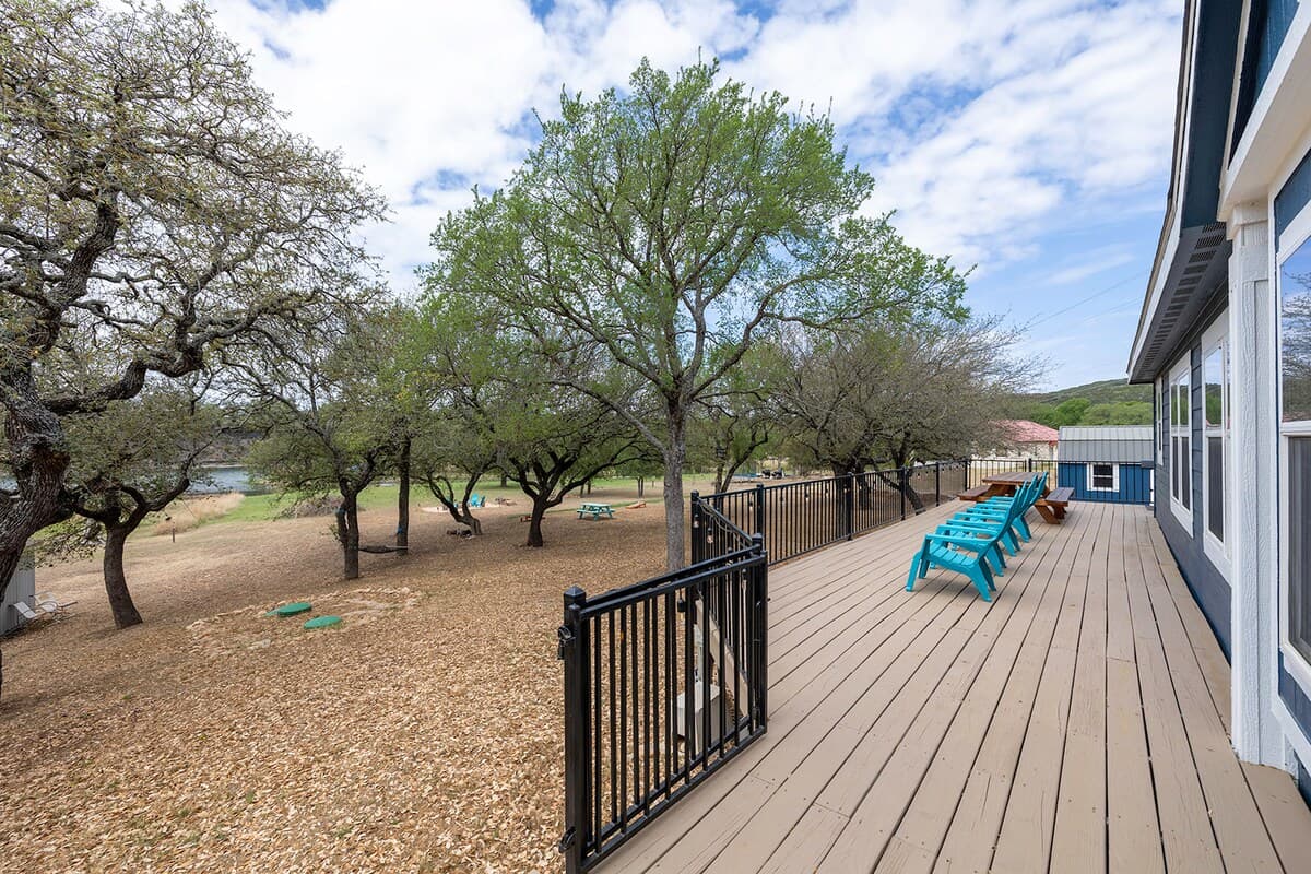 Spacious yard for relaxing, playing, and enjoying peaceful moments by the lake.