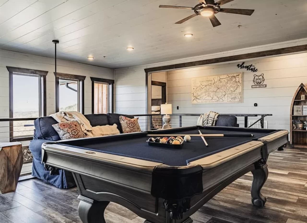 Open space upstairs with pool table