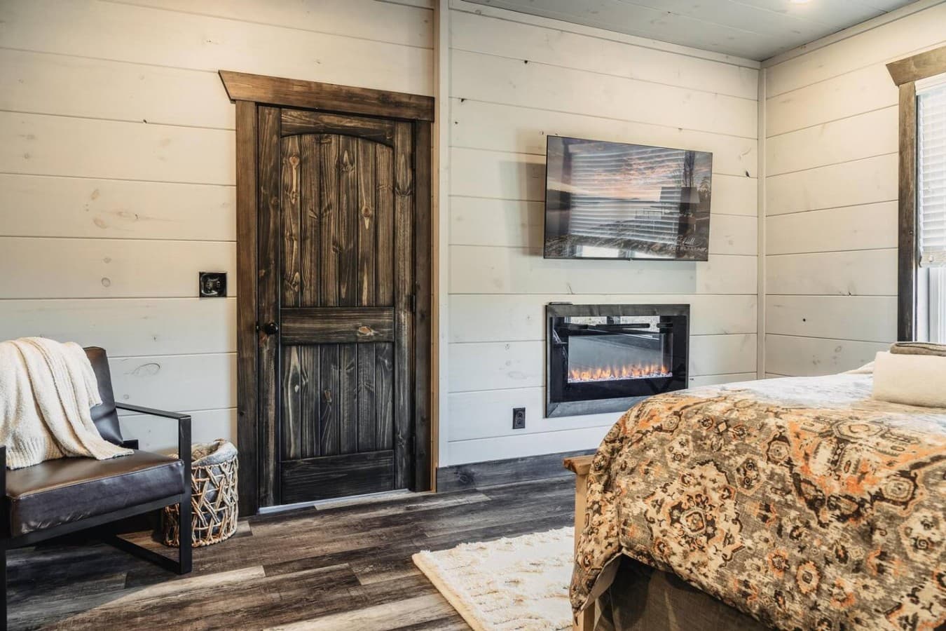 Master Bedroom (Main Floor) with a cozy fireplace