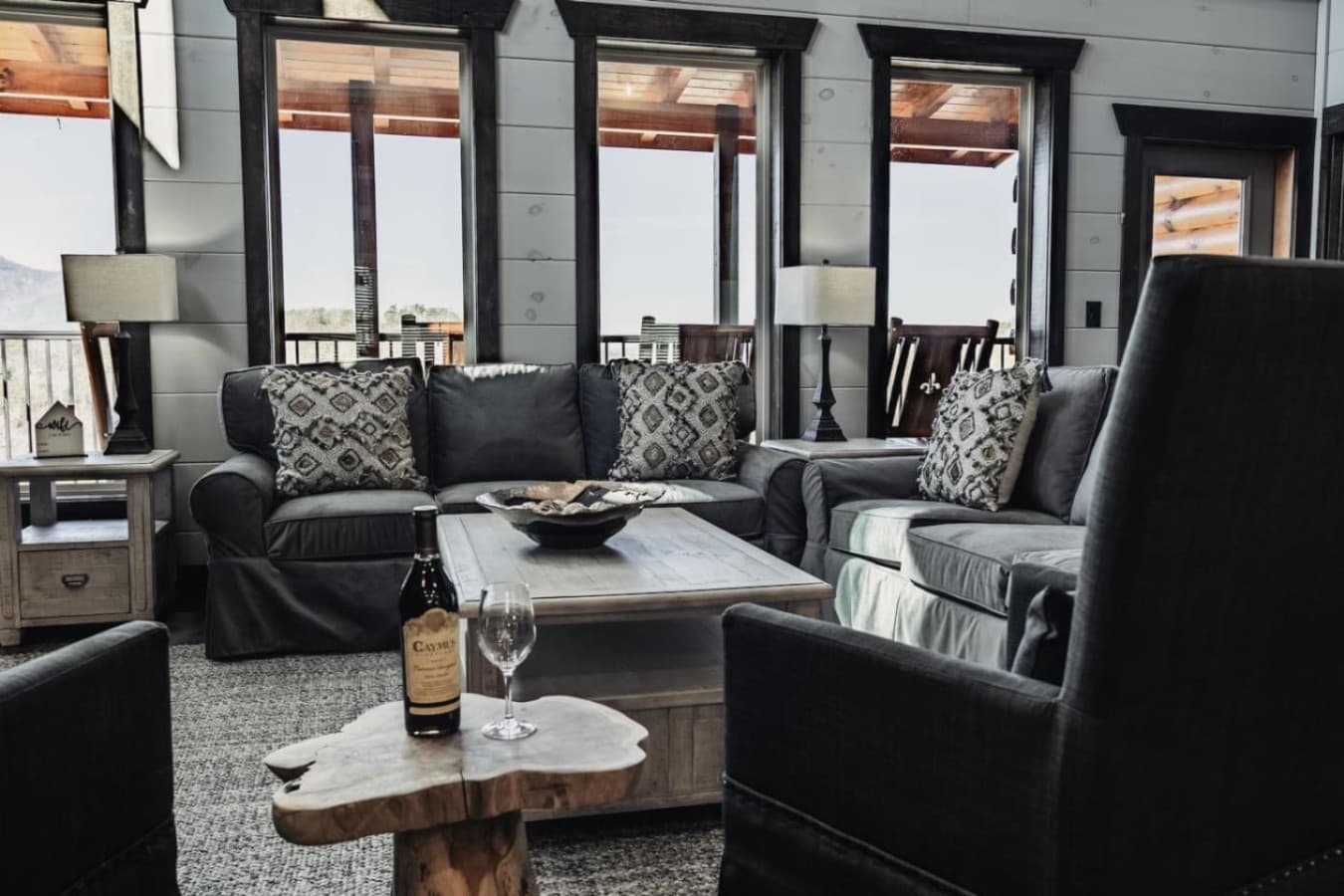 Large gathering room with comfortable seating and mountain views