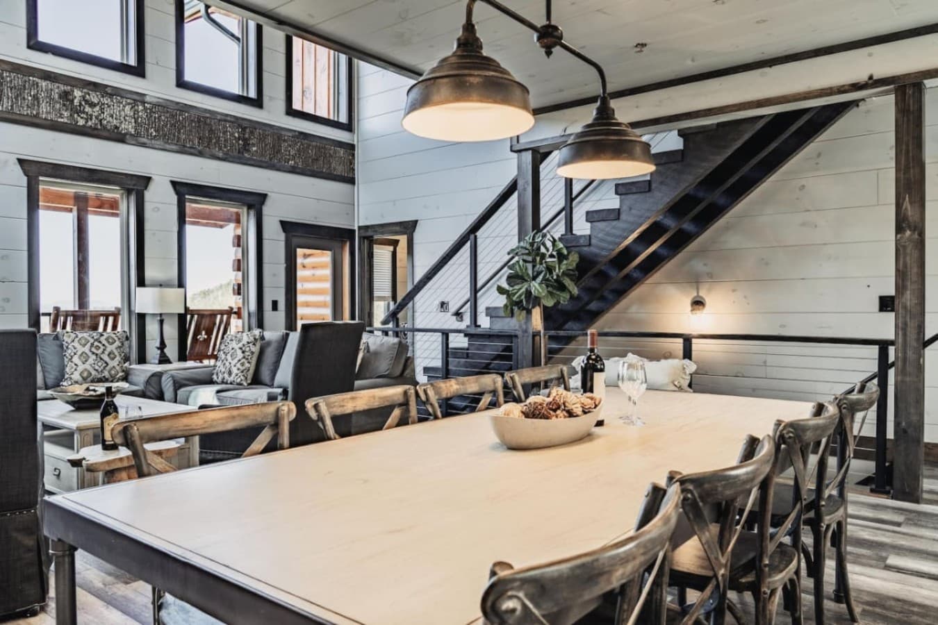 Large dining table as well as two sets of stairs to go upstairs or downstairs