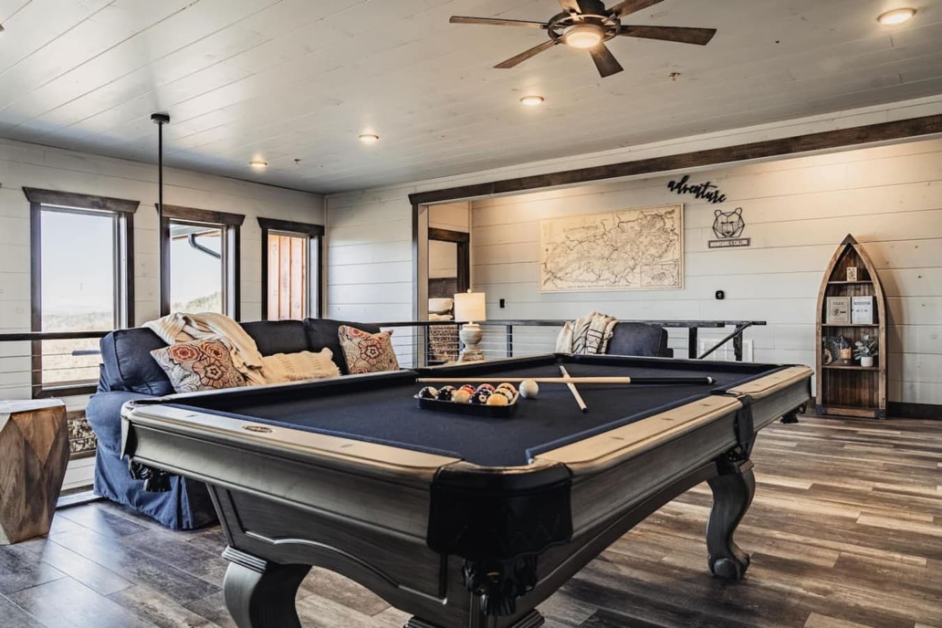The game room is located upstairs alongside 3 additional bedrooms (King 3, Queen 2 and bunk beds)