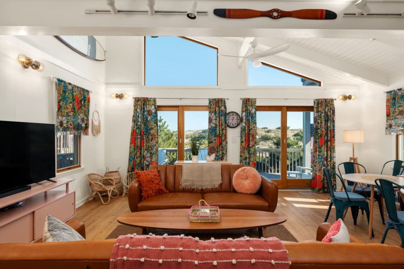 Airy living space w/ comfy sofas, TV area & easy flow to the outdoors.