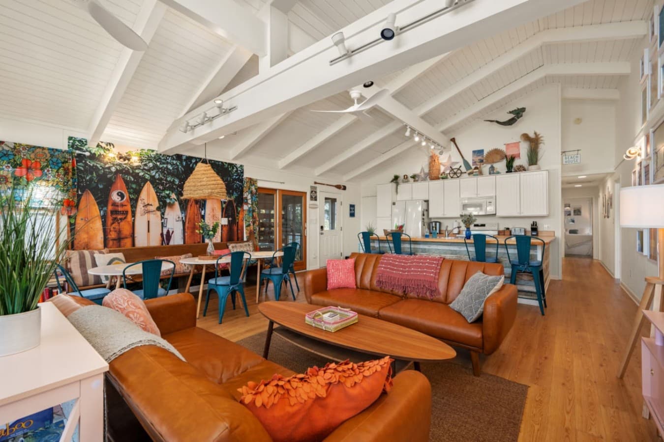 Inviting living room w/ warm wood floors, colorful decor & comfy seating made for relaxing together.