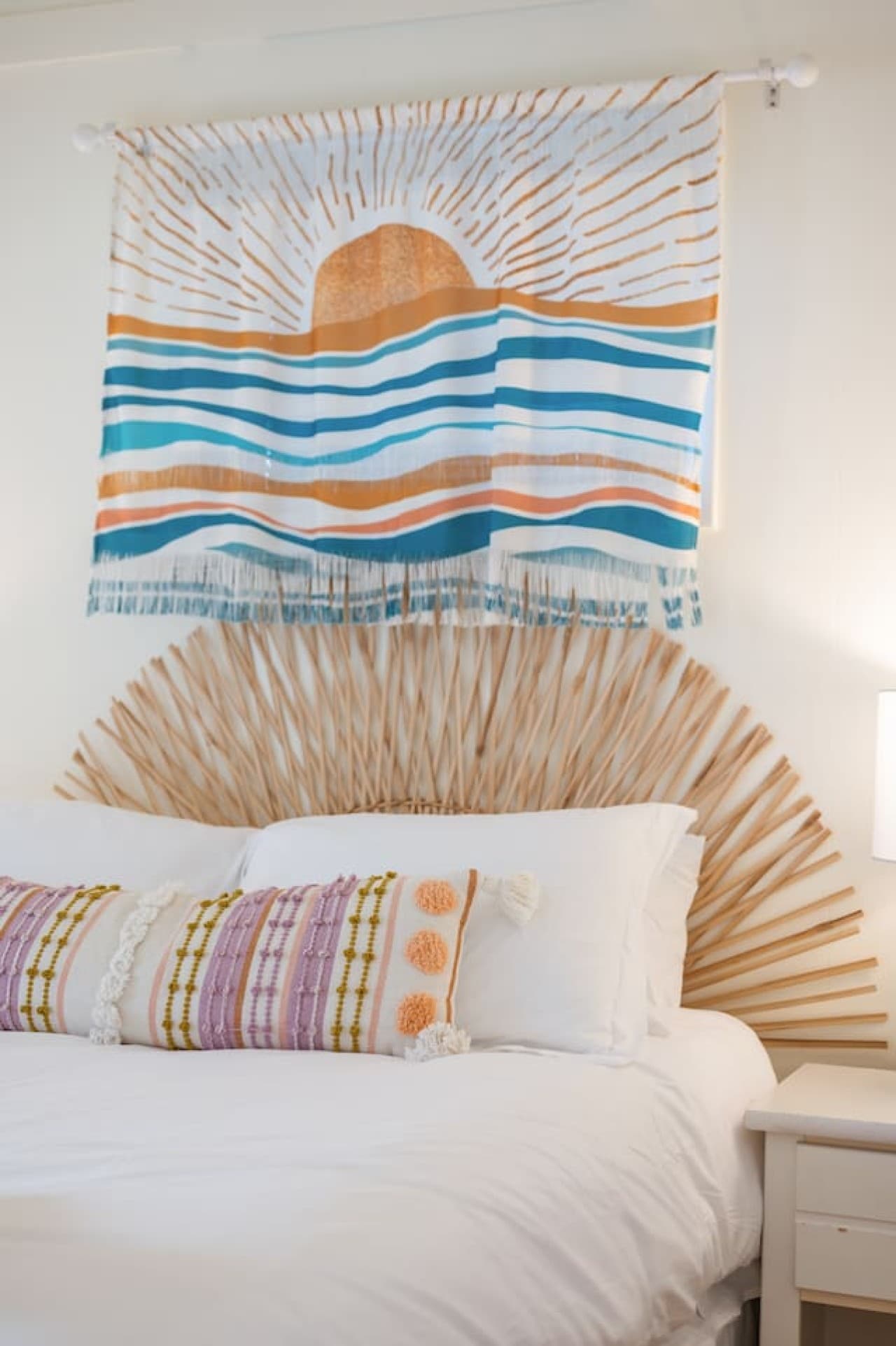 Beach-inspired wall art adding a soft coastal touch to the bedroom space.