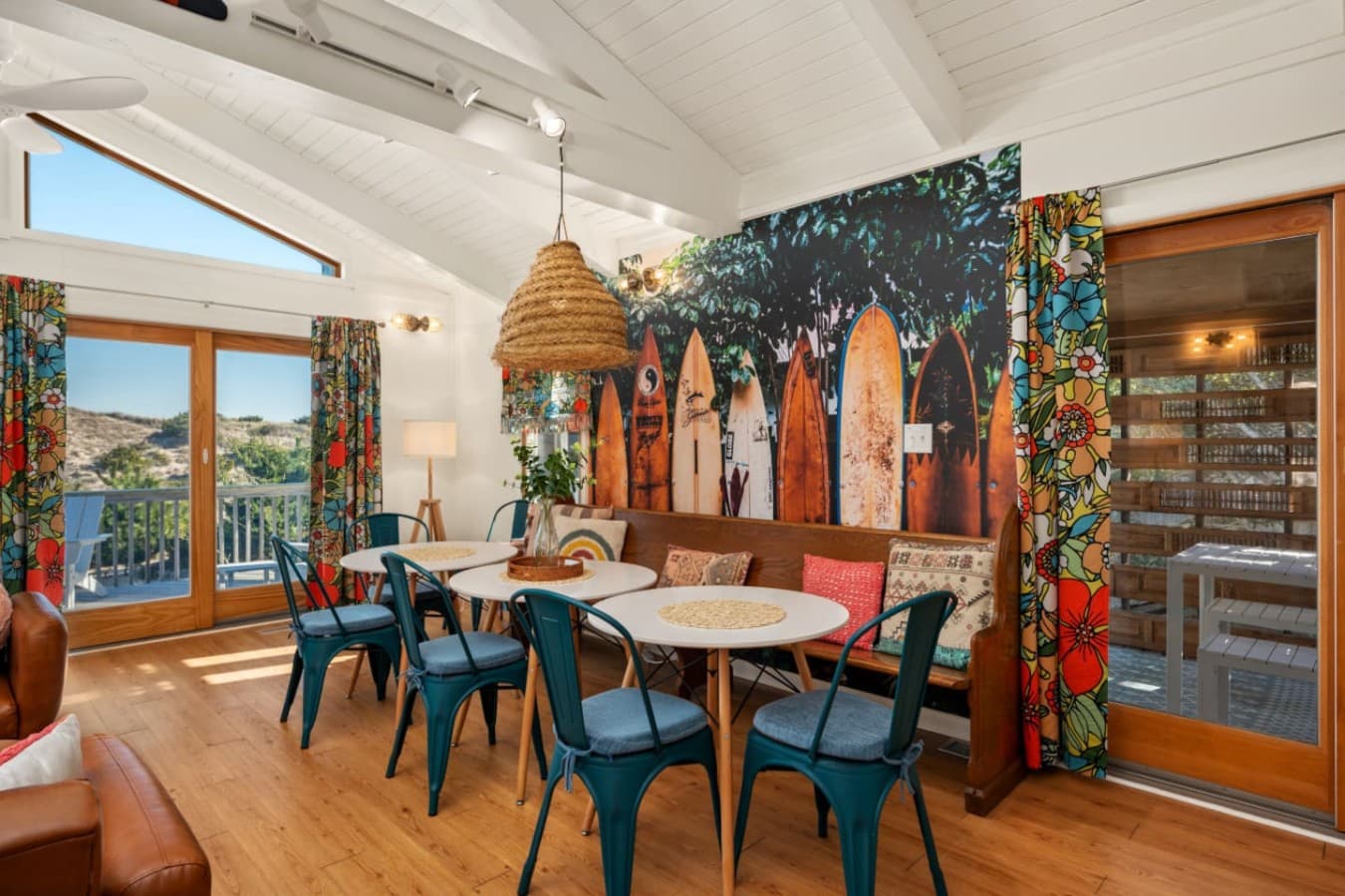Welcoming dining nook framed by greenery accents & warm, beachy textures.