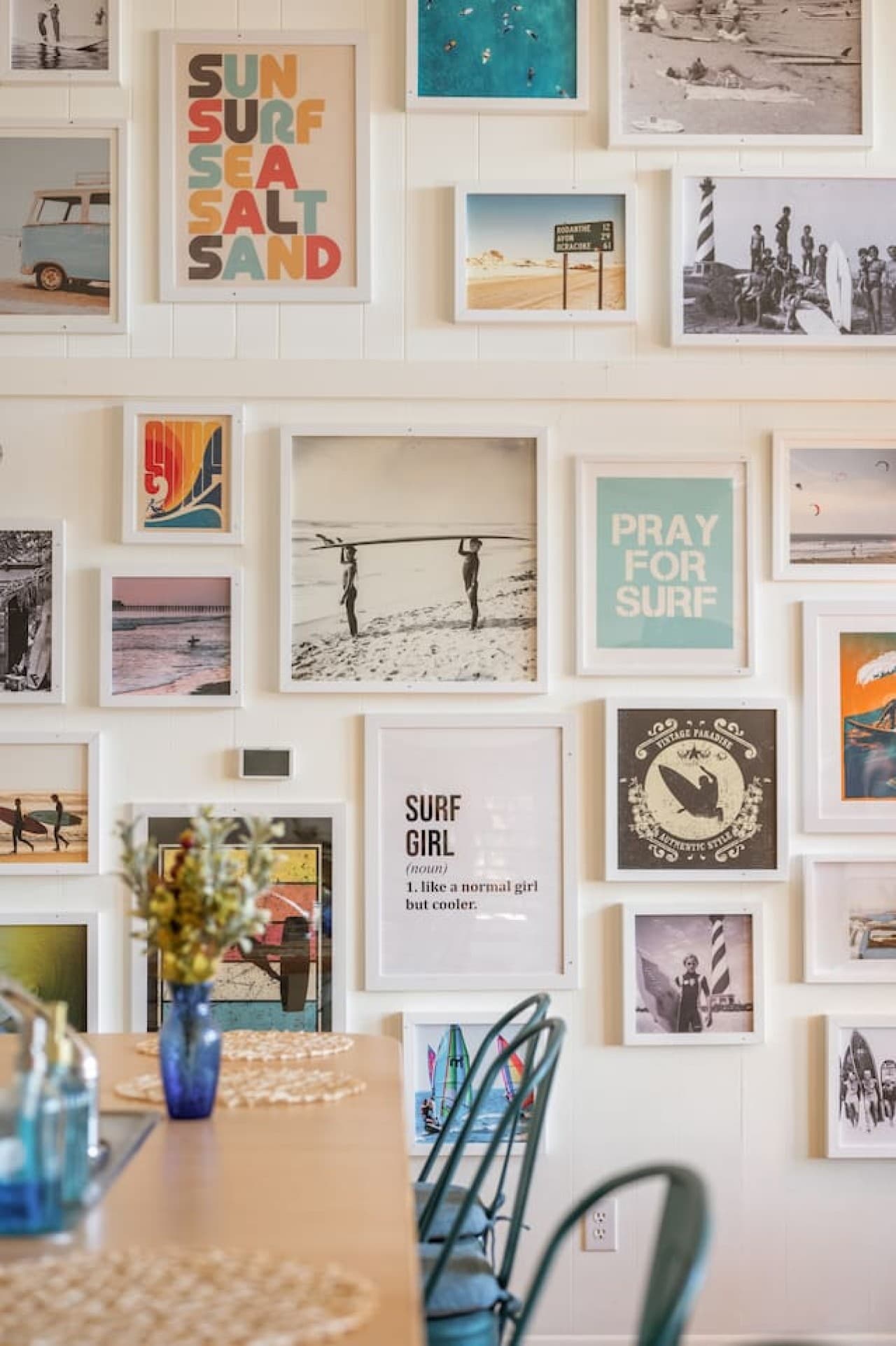 Curated gallery wall featuring playful coastal art & personal touches throughout.