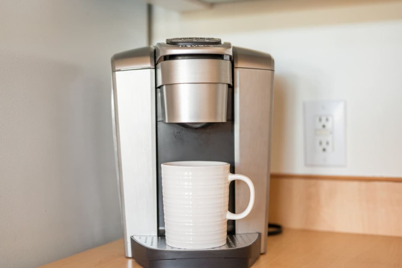 Morning coffee made easy w/ a compact coffee station tucked neatly into the kitchen.