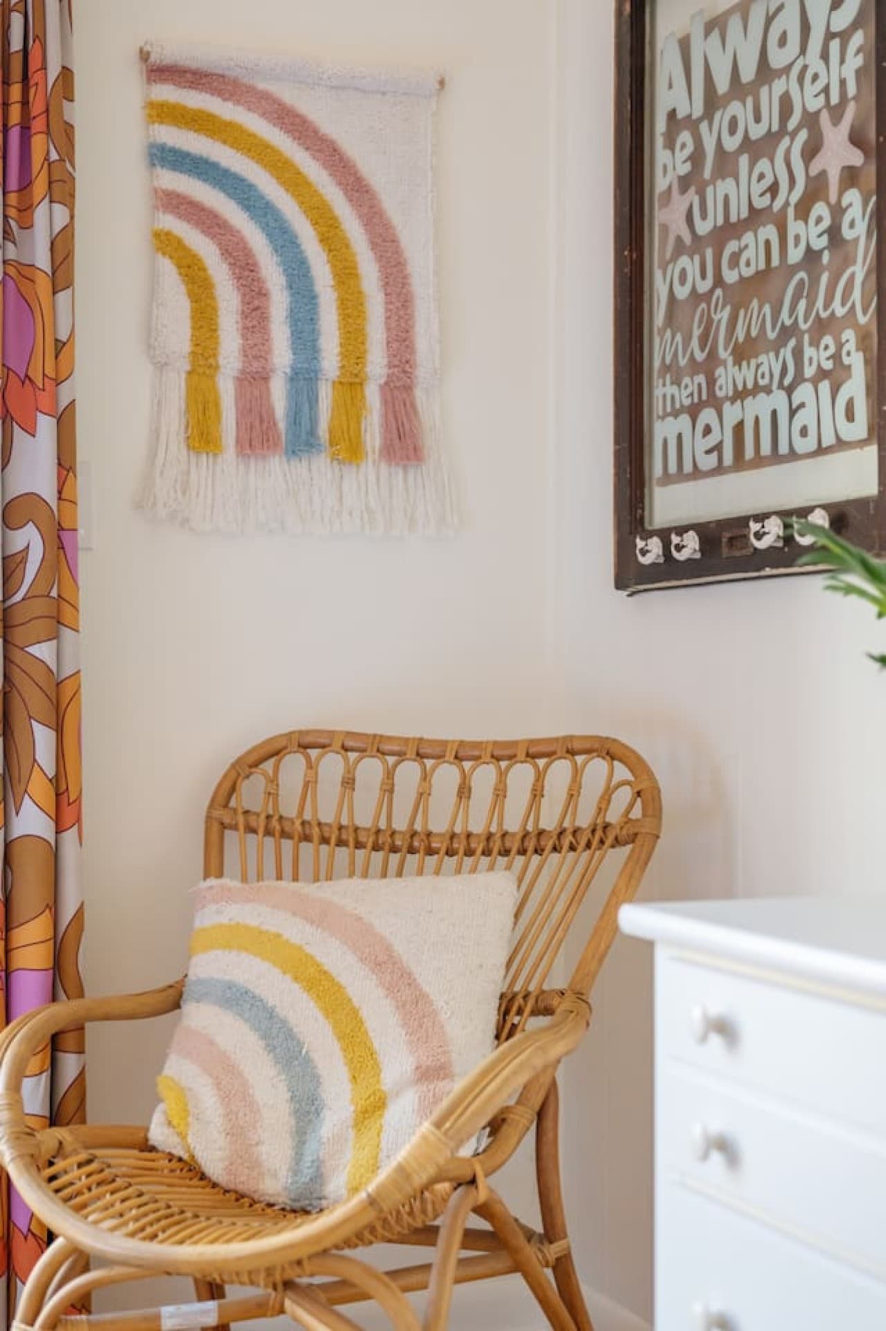Simple seating nook w/ woven bench & wall hooks for beach-day essentials.