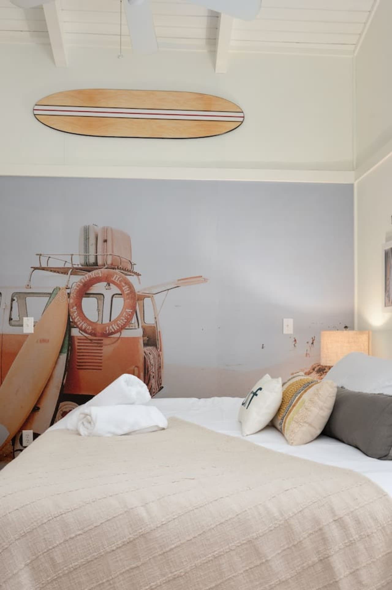 Coastal bedroom detail w/ woven textures, warm wood & relaxed beach style.
