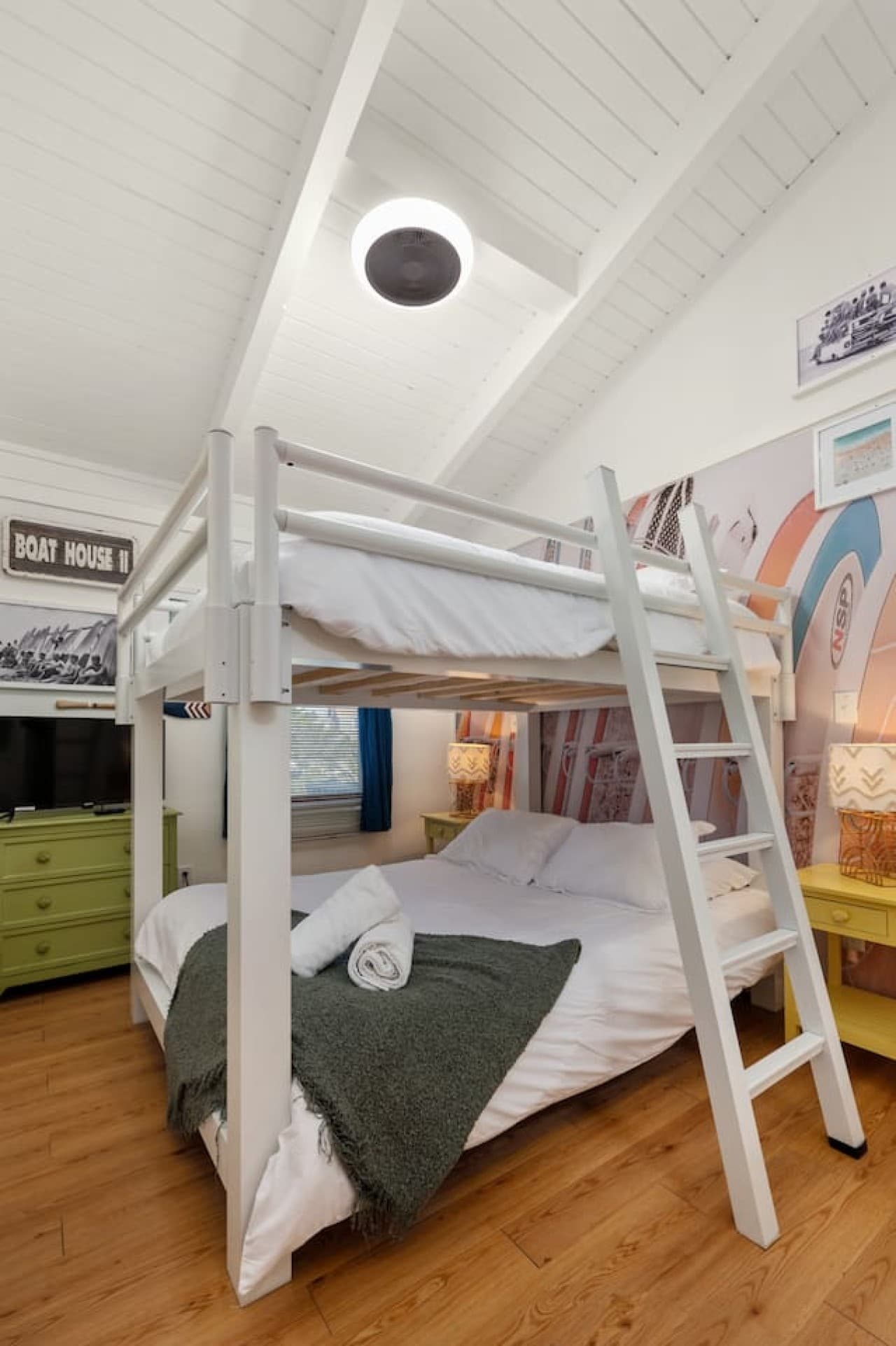 Lofted bunk setup creating a fun, space-saving sleep area w/ cozy lower nook.