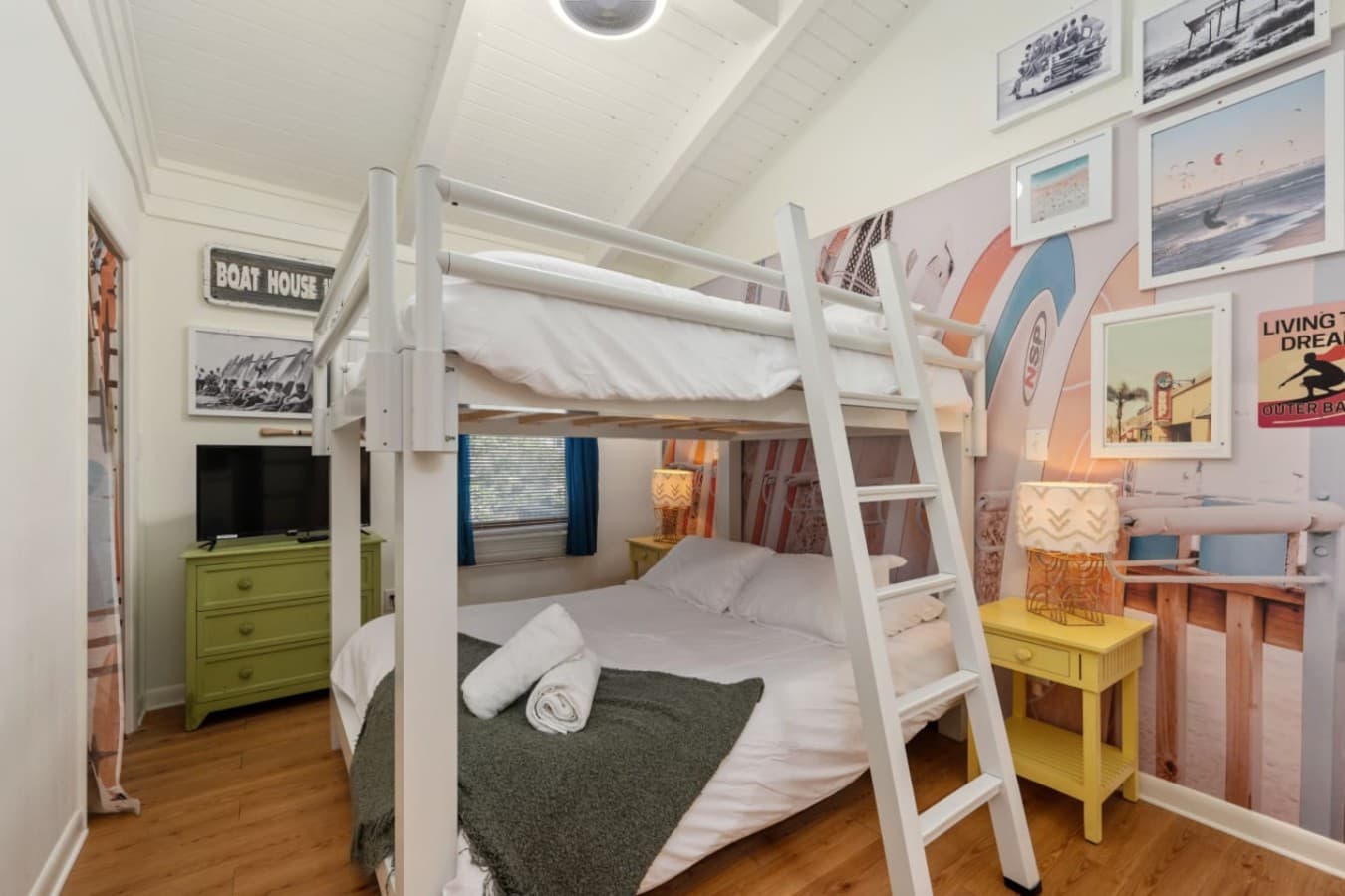 Playful bunk room w/ ladder access, bright accents & room for kids to unwind.