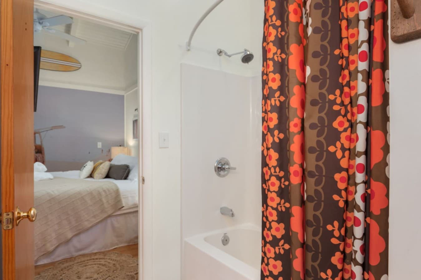Simple bedroom entry w/ patterned curtains & an easy, uncluttered layout.