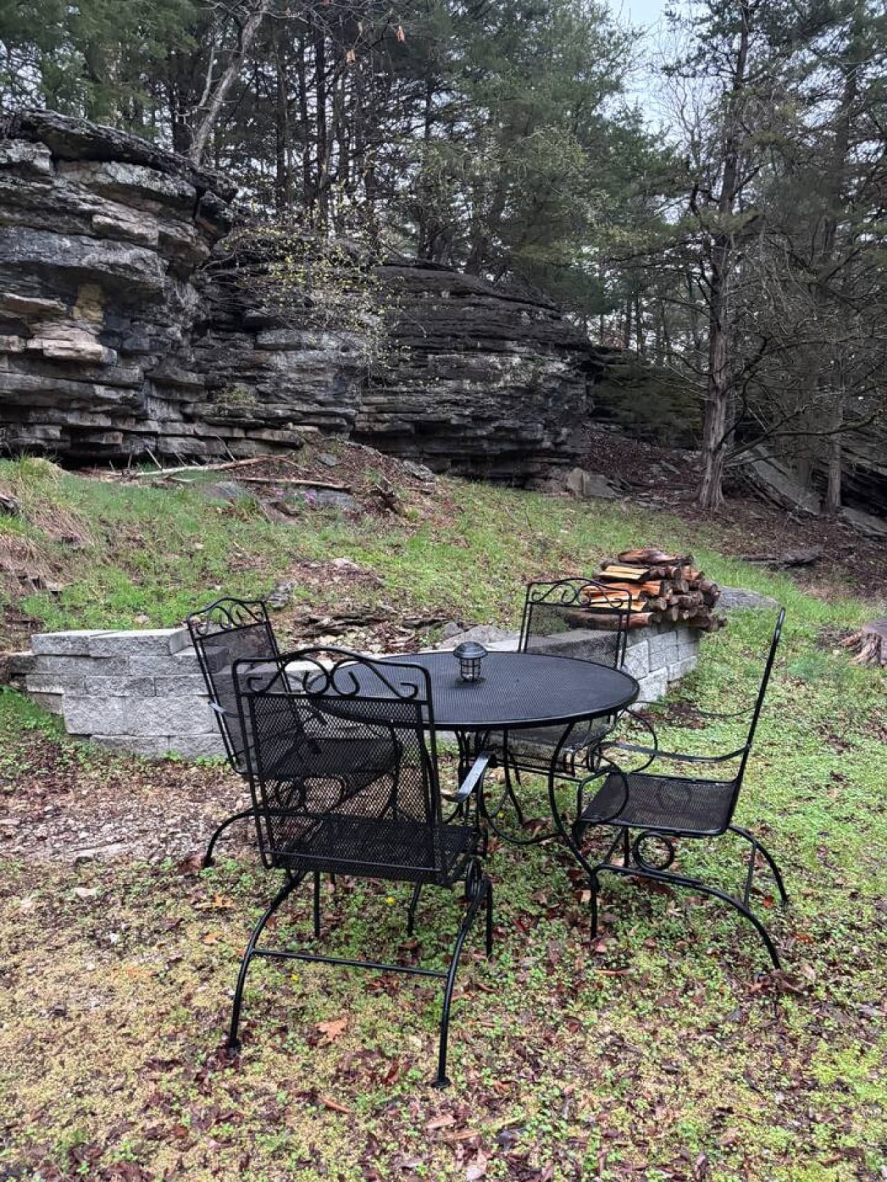 Outdoor table with fire pit. We do not provide wood for outdoor fire pit.