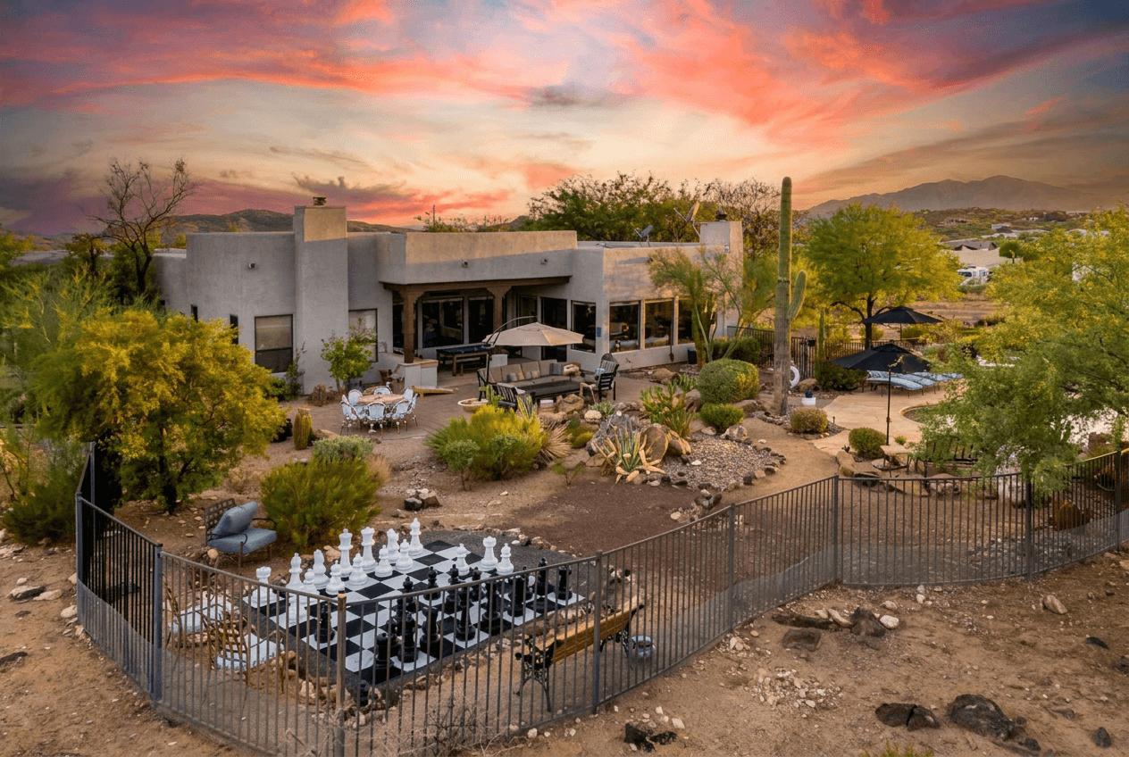 Huge fenced in patio area featuring giant chess, multiple lounge areas, billiards, ping pong, pool and hot tub. Fully fenced for easy enjoyment.