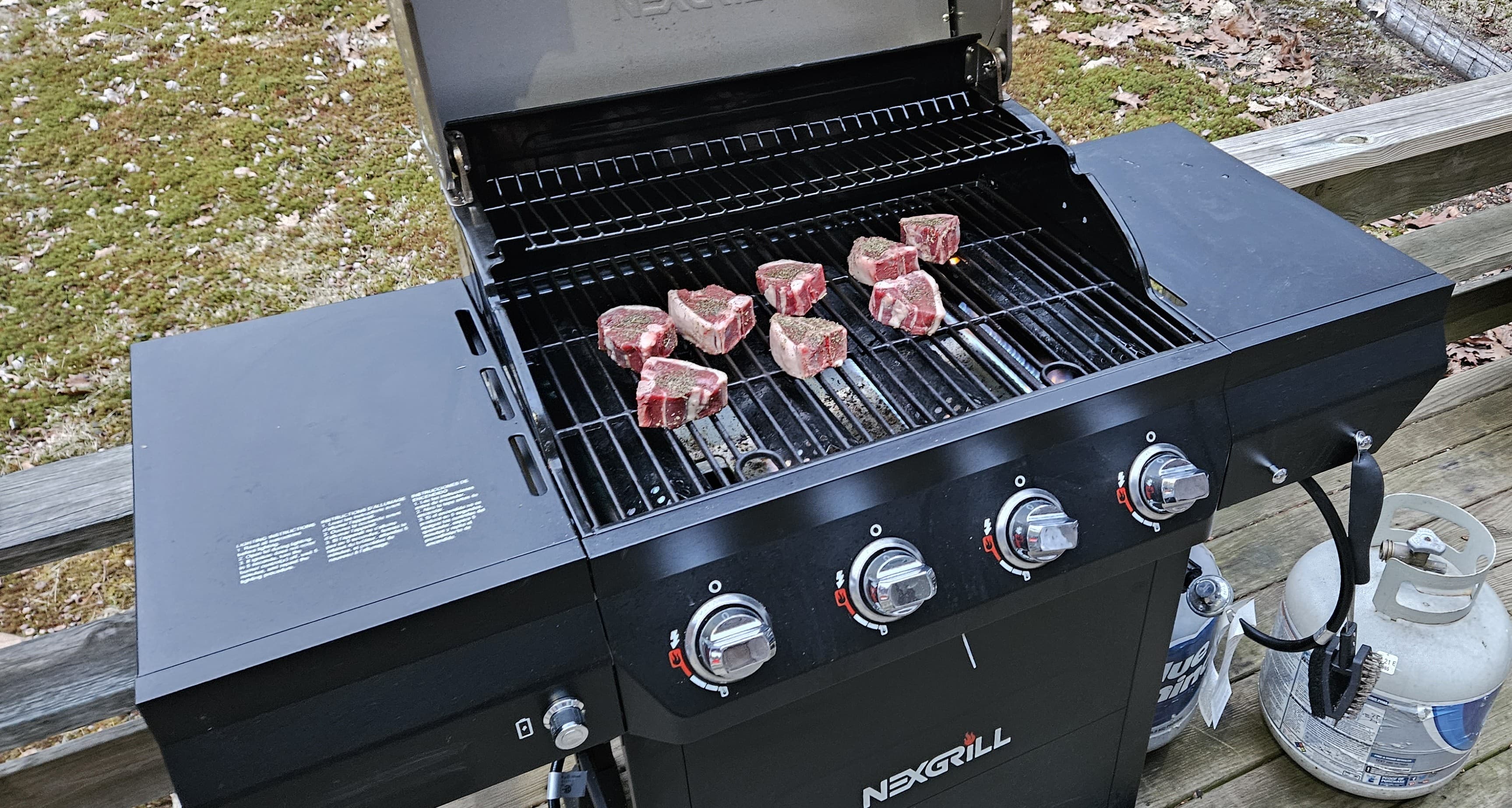 Outdoor propane BBQ grill on the patio, perfect for summer cookouts