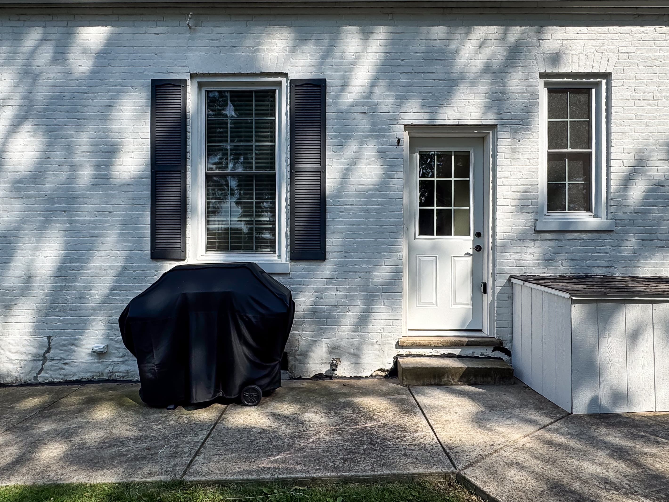 The backyard is fully fenced with a classic white picket fence that includes a gas barbecue grill for the grill master chef at Mini Aussie Cottage.