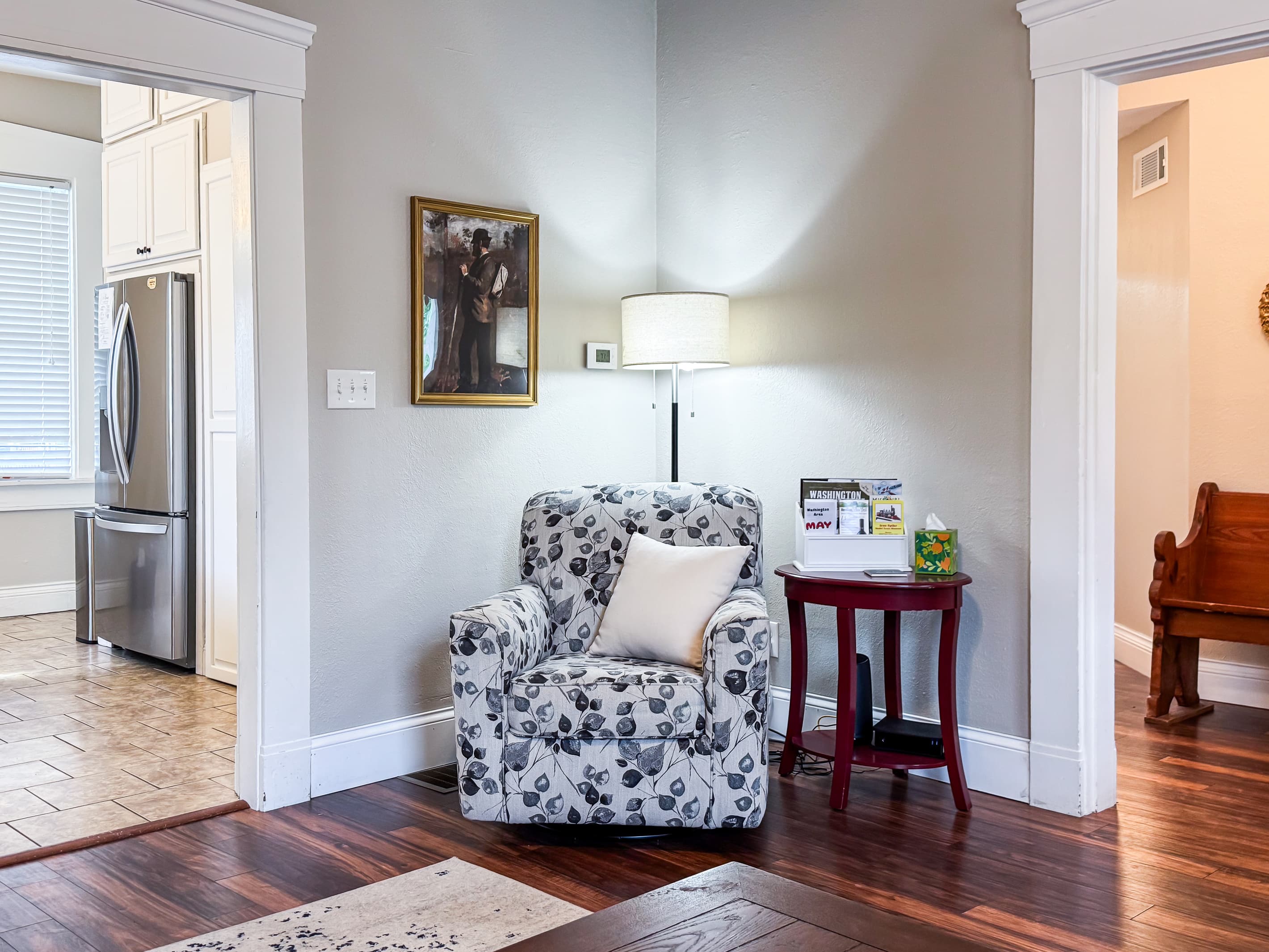 Warm and inviting Great Room with comfy leather couch, loveseat and recliner just off the kitchen for a perfect setup for families/groups to relax and reconnect at Mini Aussie Cottage.