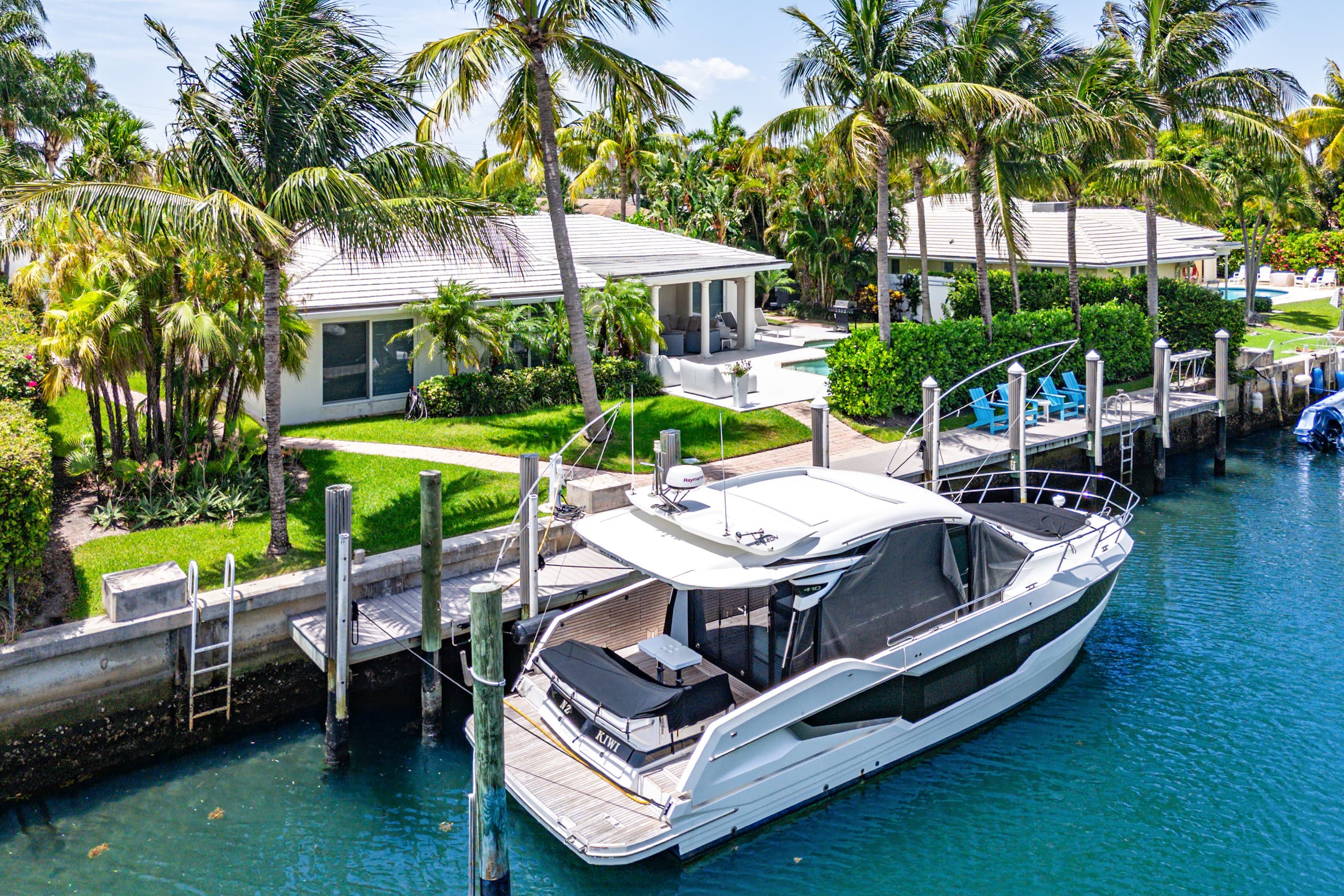 The boat shown is privately owned and not available for guest use. A separate portion of the dock is available for approved guest boats, subject to size restrictions and an additional fee.