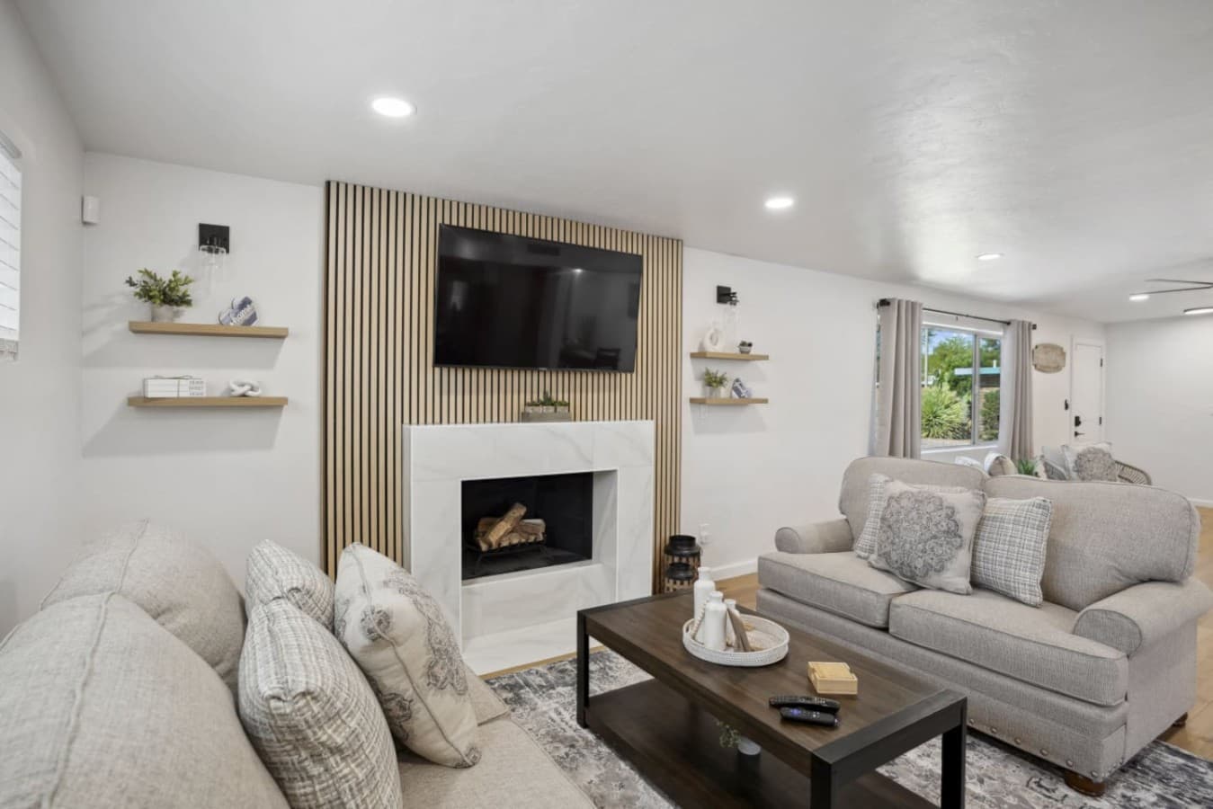 Stylish living space w/ fireplace, layered textures & a welcoming, lived-in feel.