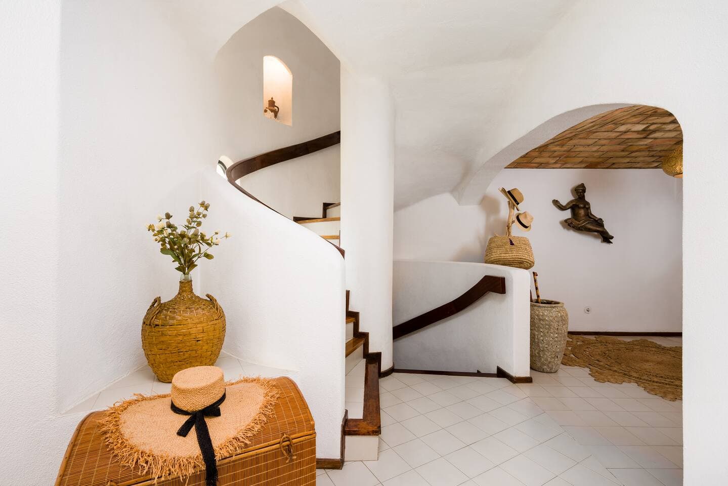 Spiral stairs leading up to the 1st floor, and down to the ground floor. 