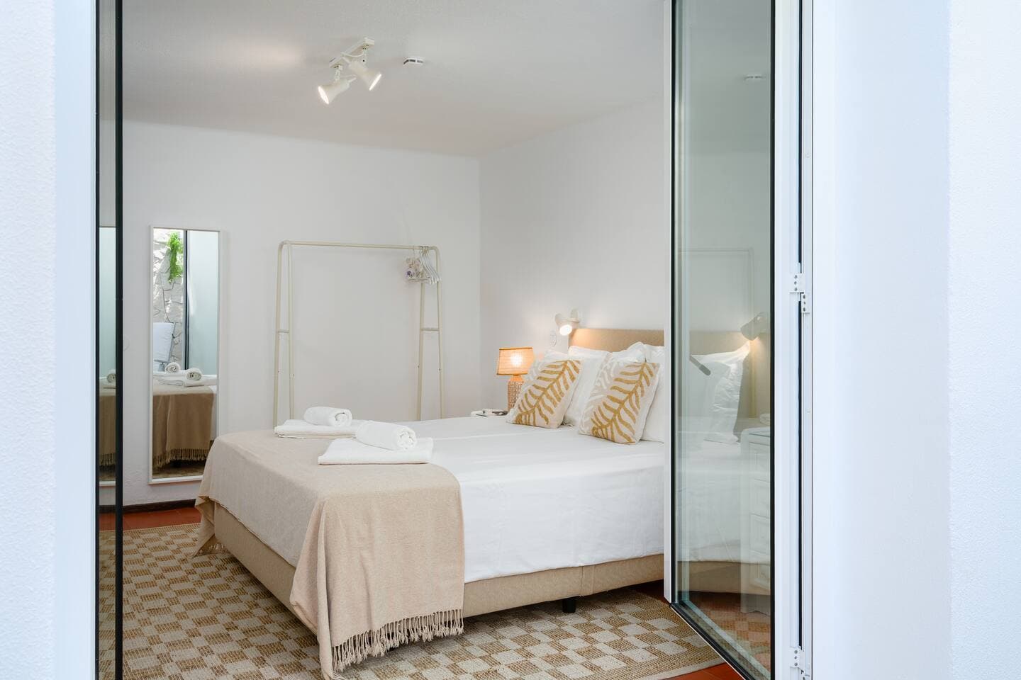 Downstairs bedroom with private inside balcony