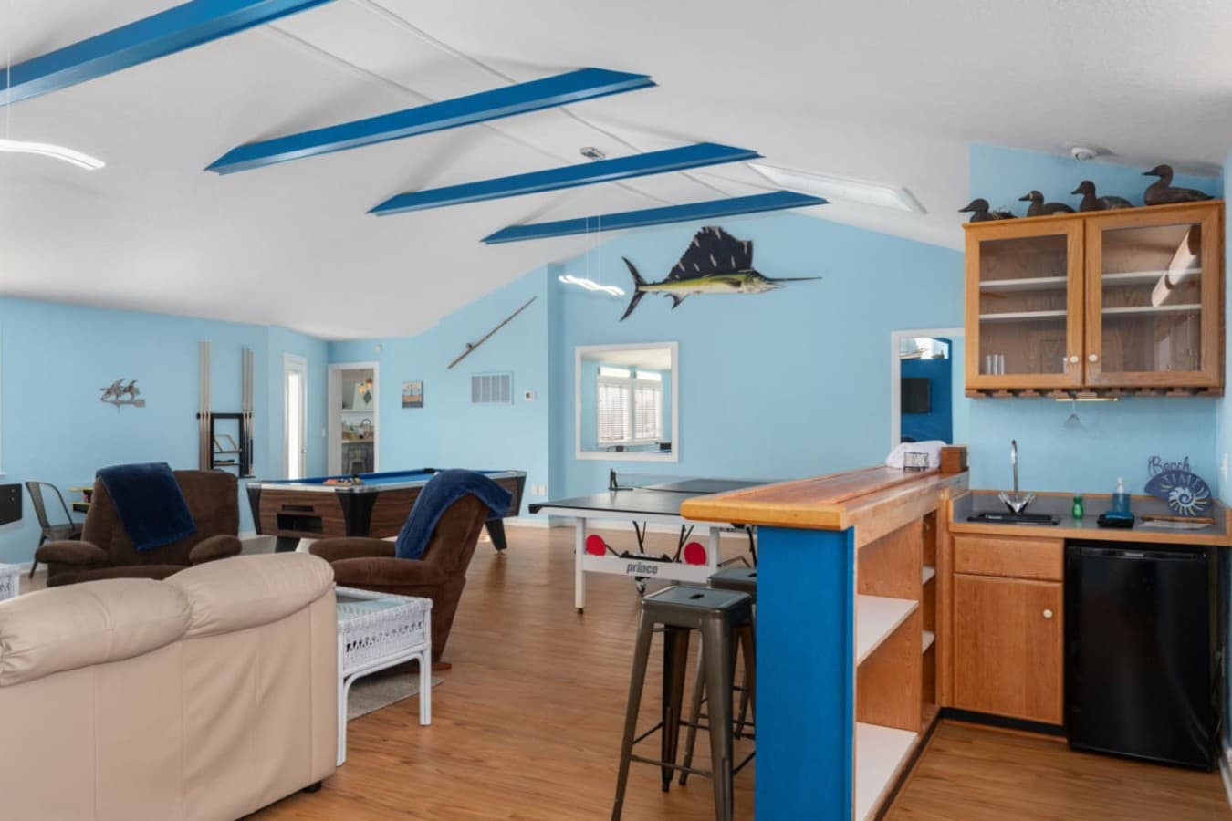 Open kitchen & dining area w/ warm wood finishes & easy flow into the living space.