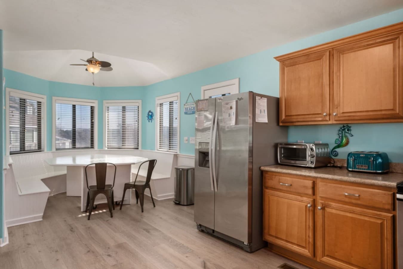Open kitchen & dining area w/ warm wood cabinets & easy flow for shared meals.